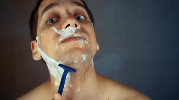 Young Man Shaving Using Disposable Razor Bathroom Closeup Daily Morning — Stock Video