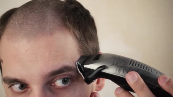 Handsome Man Bathroom Shaves His Head Electric Razor Due Coronavirus — Stock Video