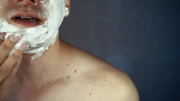 Handsome Smiling Unshaven Young Man Applying Moisturizing Shaving Foam Face — Stock Video
