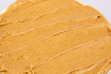 Fıstık ezmesi dokusu. Kasırga yayılımı. Organik keto yemeği. Sağlıklı kremalı macun. Pürüzsüz kahverengi çöl. Çıtır çıtır makro atıştırmalık. Yağlı tuzlu kahvaltı.