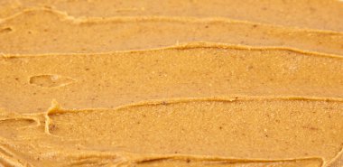 Fıstık ezmesi dokusu. Kasırga yayılımı. Organik keto yemeği. Sağlıklı kremalı macun. Pürüzsüz kahverengi çöl. Çıtır çıtır makro atıştırmalık. Yağlı tuzlu kahvaltı.