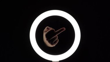 gesture package. female hands close-up make figures from fingers. finger play. Middle finger up. Obscene gesture fuck yourself.