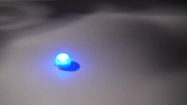 Bubbling water in hookah. Drawing hookah with bubbling blue water and exhaling smoke. Hookah bowl with boiling water on background of blue lights. Hookah bar