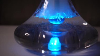 hookah. water gurgles in a hookah vessel. close-up. Bubbling water in hookah. Hookah bowl with boiling water