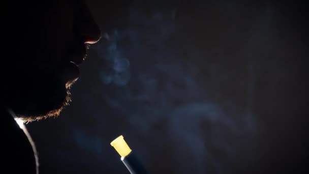 Young Man Backlight Smokes Traditional Hookah Dark Room Concept Bad — Vídeos de Stock