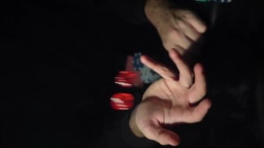 Game of dice. The guy rolls the dice for a winning combination. vertical video. Slow motion