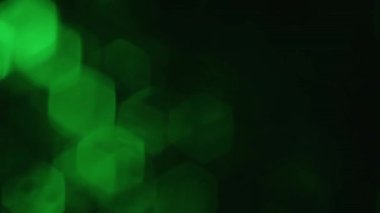 Animated abstract background and fading green particles designed as a background, texture or pattern concept
