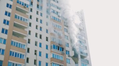 Kyiv, Ukraine - November 15, 2022: Fire in an apartment building, firefighters fighting the flames, burning house, fire disaster and accident tragedy concept