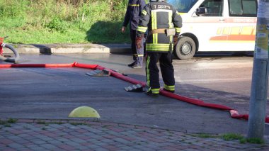 Kyiv, Ukraine - November 15, 2022: Consequences of an extinguished fire. Equipment for stacking fire trucks. High-rise residential building. The concept of completing a dangerous job