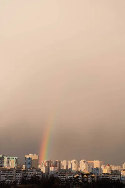 Double rainbow against the sunset sky. Leprechaun at the end of the rainbow. Rainbow as a concept of fantastic money. Pot of gold. St.Patrick \'s Day
