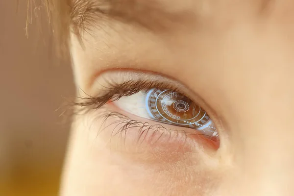 Close-up of a male eye with visual effects. The concept of a sensor implanted in the human eye. Business, computer, cyberspace