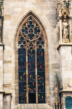 Vienna, Austria - May 12, 2019: Imposing architectural details close-up. View, details, architectures and embellishments. Partial view looking up at the majestic St. Stephens Cathedral in Vienna clipart