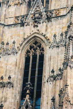 Vienna, Austria - May 12, 2019: Imposing architectural details close-up. View, details, architectures and embellishments. Partial view looking up at the majestic St. Stephens Cathedral in Vienna clipart