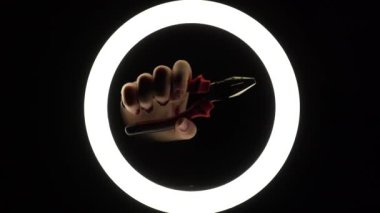 female hands hold pliers. adjustable tool on a black background close-up. hand tool for repair. manual work.