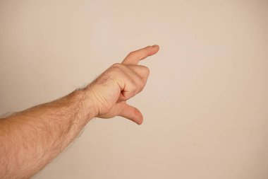 Hand gesture where thumb and index finger form a small gap. Concept represents precision and minimum size. Neutral background focuses attention on gesture. Hand shows with fingers a conditional size clipart