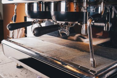 The intricate details of the coffee machine s dials and levers are captured close-up, symbolizing the sophistication of modern brewing