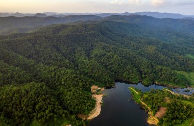 beautiful lake above the dam among blue sky clouds and mountains,lake mountain view