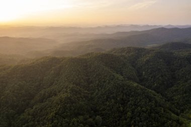 Top view Landscape of Morning Mist with Mountain Layer at north of Thailand. mountain ridge and clouds in rural jungle bush forest