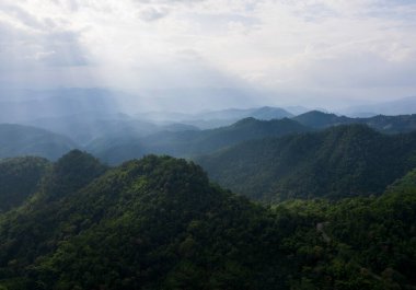 Top view Landscape of Morning Mist with Mountain Layer at north of Thailand. mountain ridge and clouds in rural jungle bush forest