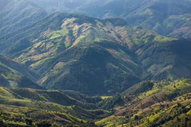 Top view Landscape of Morning Mist with Mountain Layer at north of Thailand. mountain ridge and clouds in rural jungle bush forest