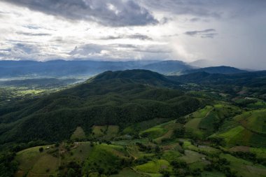 Top view Landscape of Morning Mist with Mountain Layer at north of Thailand. mountain ridge and clouds in rural jungle bush forest