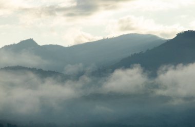 Top view Landscape of Morning Mist with Mountain Layer at north of Thailand. mountain ridge and clouds in rural jungle bush forest