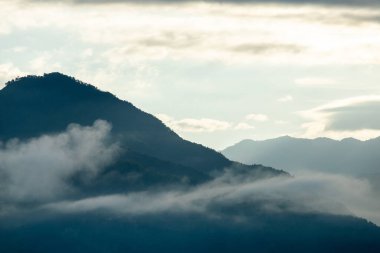 Top view Landscape of Morning Mist with Mountain Layer at north of Thailand. mountain ridge and clouds in rural jungle bush forest