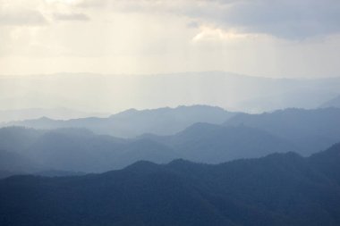 Top view Landscape of Morning Mist with Mountain Layer at north of Thailand. mountain ridge and clouds in rural jungle bush forest