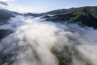 Top view Landscape of Morning Mist with Mountain Layer at north of Thailand. mountain ridge and clouds in rural jungle bush forest
