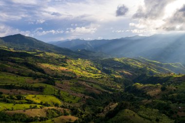 Top view Landscape of Morning Mist with Mountain Layer at north of Thailand. mountain ridge and clouds in rural jungle bush forest