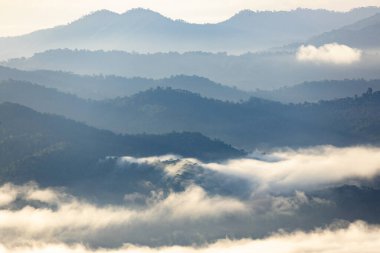 Top view Landscape of Morning Mist with Mountain Layer at north of Thailand. mountain ridge and clouds in rural jungle bush forest