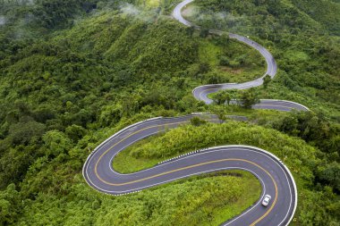 Top view Landscape of Morning Mist with Mountain Layer at north of Thailand. mountain ridge and clouds in rural jungle bush forest