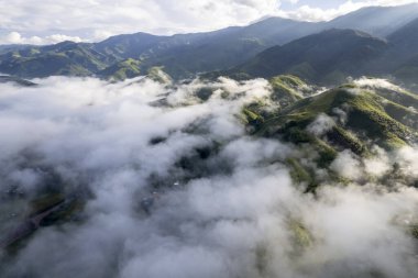 Top view Landscape of Morning Mist with Mountain Layer at north of Thailand. mountain ridge and clouds in rural jungle bush forest