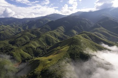 Top view Landscape of Morning Mist with Mountain Layer at north of Thailand. mountain ridge and clouds in rural jungle bush forest