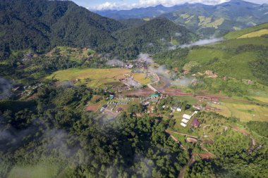 Top view Landscape of Morning Mist with Mountain Layer at north of Thailand. mountain ridge and clouds in rural jungle bush forest