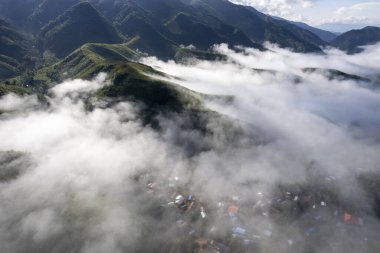 Landscape of Morning Mist with Mountain Layer at north of Thailand. mountain ridge and clouds in rural jungle bush forest