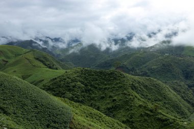 Landscape of Morning Mist with Mountain Layer at north of Thailand. mountain ridge and clouds in rural jungle bush forest