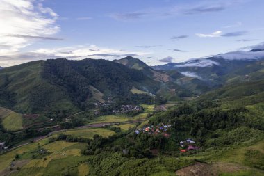 Landscape of Morning Mist with Mountain Layer at north of Thailand. mountain ridge and clouds in rural jungle bush forest