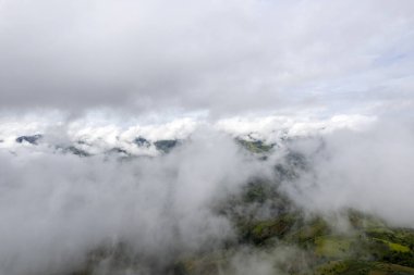 Landscape of Morning Mist with Mountain Layer at north of Thailand. mountain ridge and clouds in rural jungle bush forest