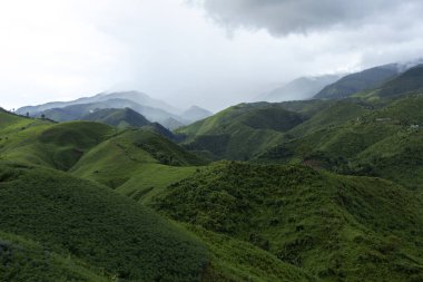 Landscape of Morning Mist with Mountain Layer at north of Thailand. mountain ridge and clouds in rural jungle bush forest