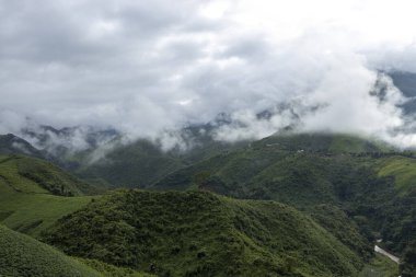 Landscape of Morning Mist with Mountain Layer at north of Thailand. mountain ridge and clouds in rural jungle bush forest