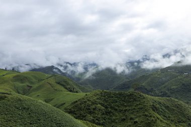 Landscape of Morning Mist with Mountain Layer at north of Thailand. mountain ridge and clouds in rural jungle bush forest
