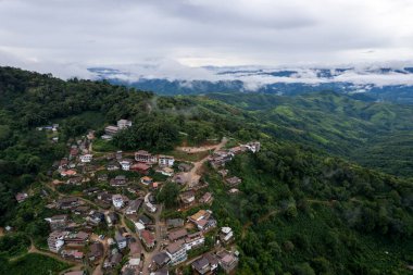 Landscape of Morning Mist with Mountain Layer at north of Thailand. mountain ridge and clouds in rural jungle bush forest