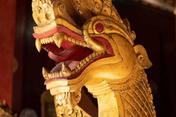 stock image Close-up of fearsome snake-like Nagas part of a religious ceremonial barge, inside the temple Wat Xieng Thong, in Luang Prabang, Laos