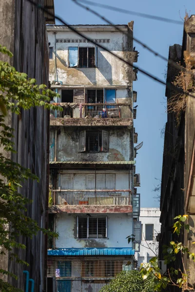 stock image Yangon, Myanmar - Dec 19, 2019: Facade of an old and dilapidated residential building in Yangon, Burma, Myanmar