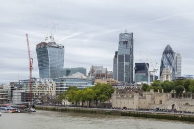 London, UK - Sep. 15, 2013: Panoramic view of the skyline and the buildings and skyscrapers in London's financial district, such as the Ledenhall, the Gherkin or the Walkie-Talkie, in United Kingdom. clipart