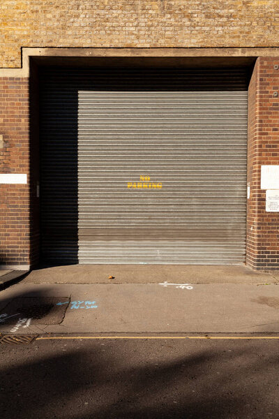 Access door to an old warehouse in a typical brick building, London