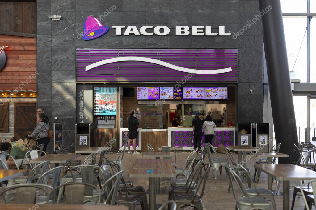 Zaragoza, Spain - 30 april, 2025: U.S. fast food restaurant chain, Taco Bell, cooks Tex-Mex style food, Puerto Venecia