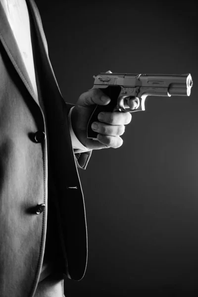 Retro secret agent with pistol revolver gun in hand in vintage crime thriller mockup cover     photo.