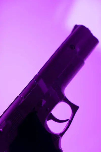 Automatic 9mm pistol gun crime thriller book cover design photo.